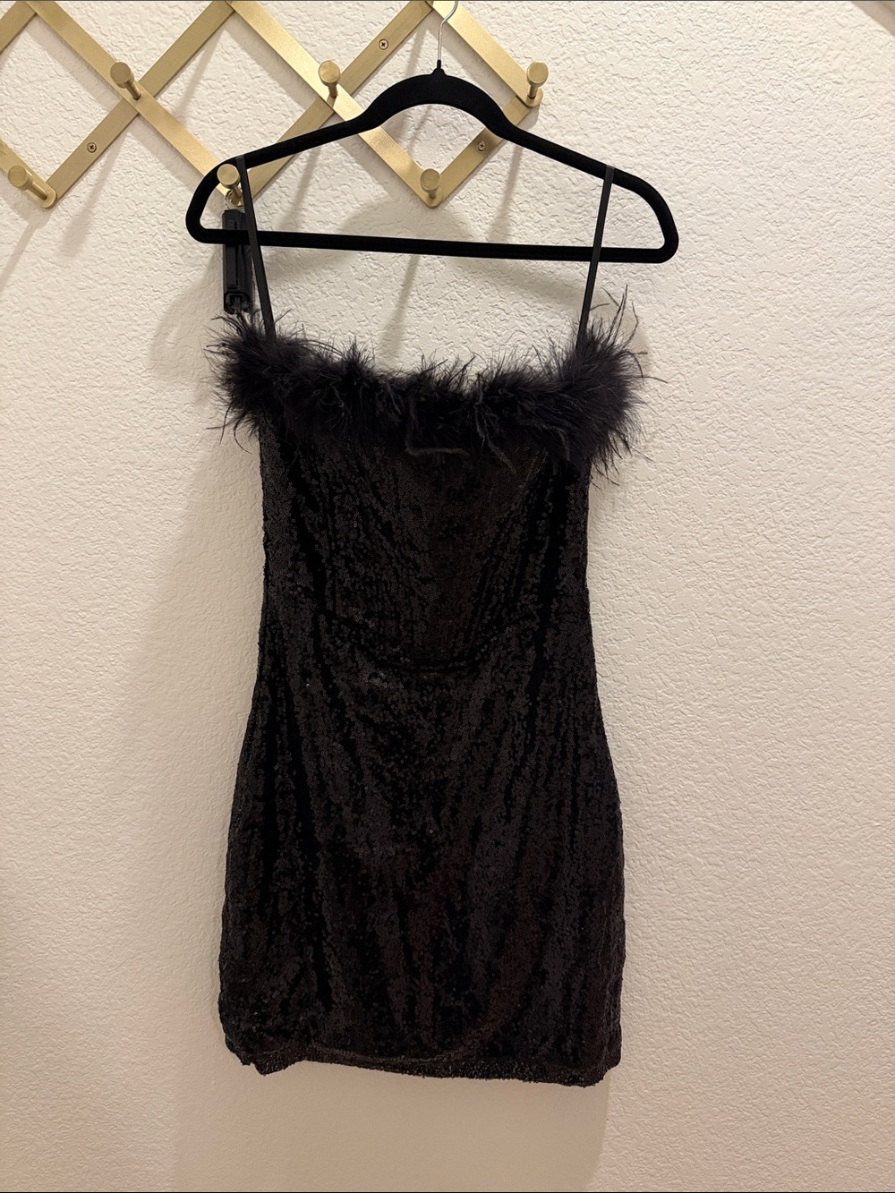 Strapless black sequin mini dress with feather trim